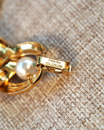 Close-up of fold-over clasp signed Napier and stamped PAT. 4,774,743.