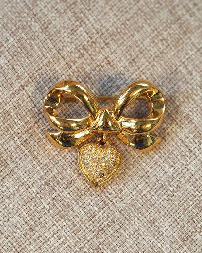 Vintage Elizabeth Taylor White Diamonds Brooch, Rhinestone Bow with Heart Charm, Signed 1990s Designer Pin, Coquette Gift Brooch - GlamGram NYC