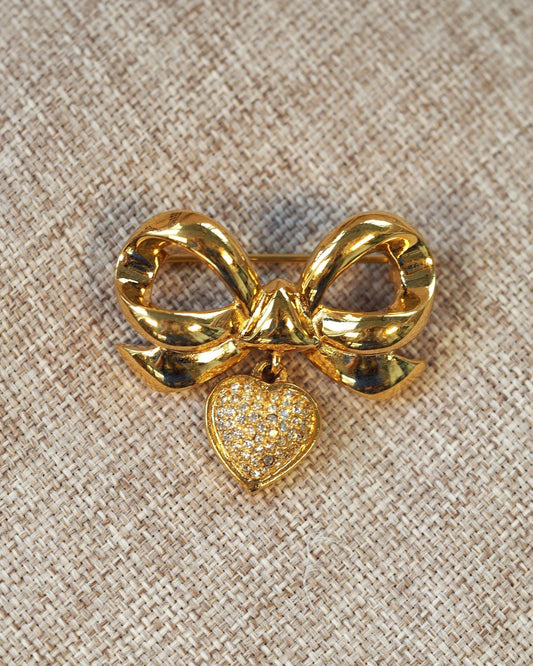 Vintage Elizabeth Taylor White Diamonds Brooch, Rhinestone Bow with Heart Charm, Signed 1990s Designer Pin, Coquette Gift Brooch - GlamGram NYC