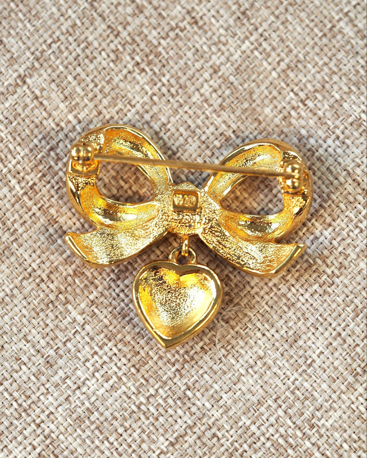 Vintage Elizabeth Taylor White Diamonds Brooch, Rhinestone Bow with Heart Charm, Signed 1990s Designer Pin, Coquette Gift Brooch - GlamGram NYC