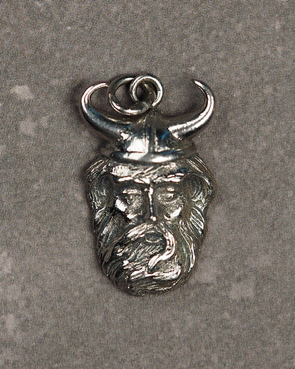 Front view of vintage Kinney sterling silver Viking head charm pendant