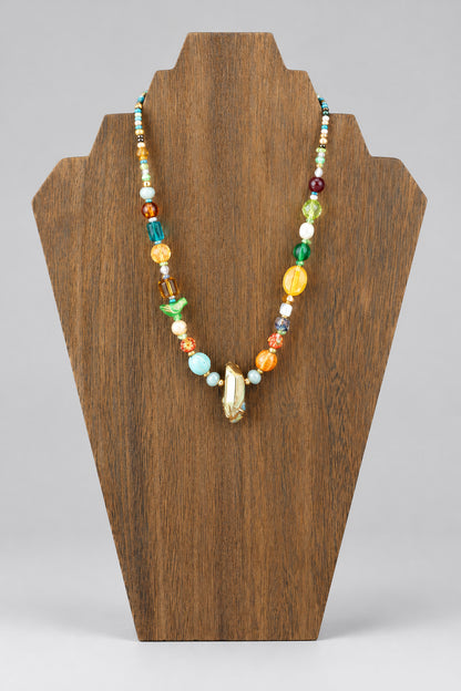 GlamGram Original mixed Czech and Japanese glass bead necklace on wood stand, front view