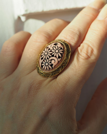 Ring worn on finger for scale, showing size and height of oval cabochon against hand