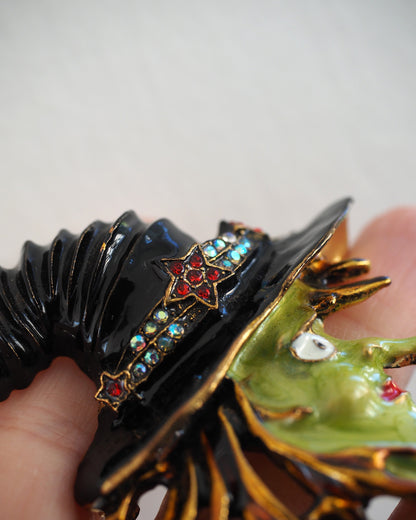 Black enamel witch hat with red star and rhinestone band detail