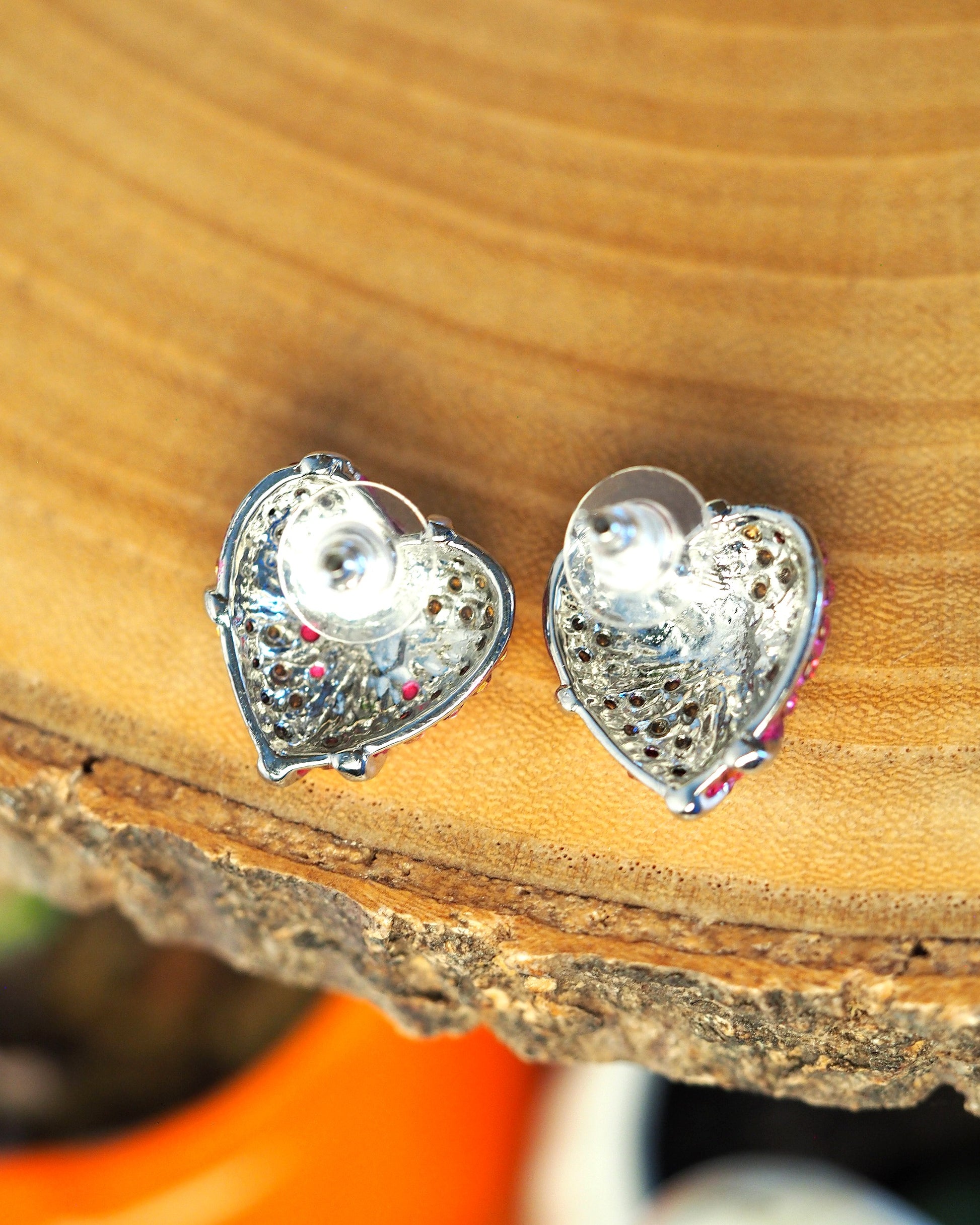 back view of 1980s heart earrings showing post backs and unmarked silver-tone metal