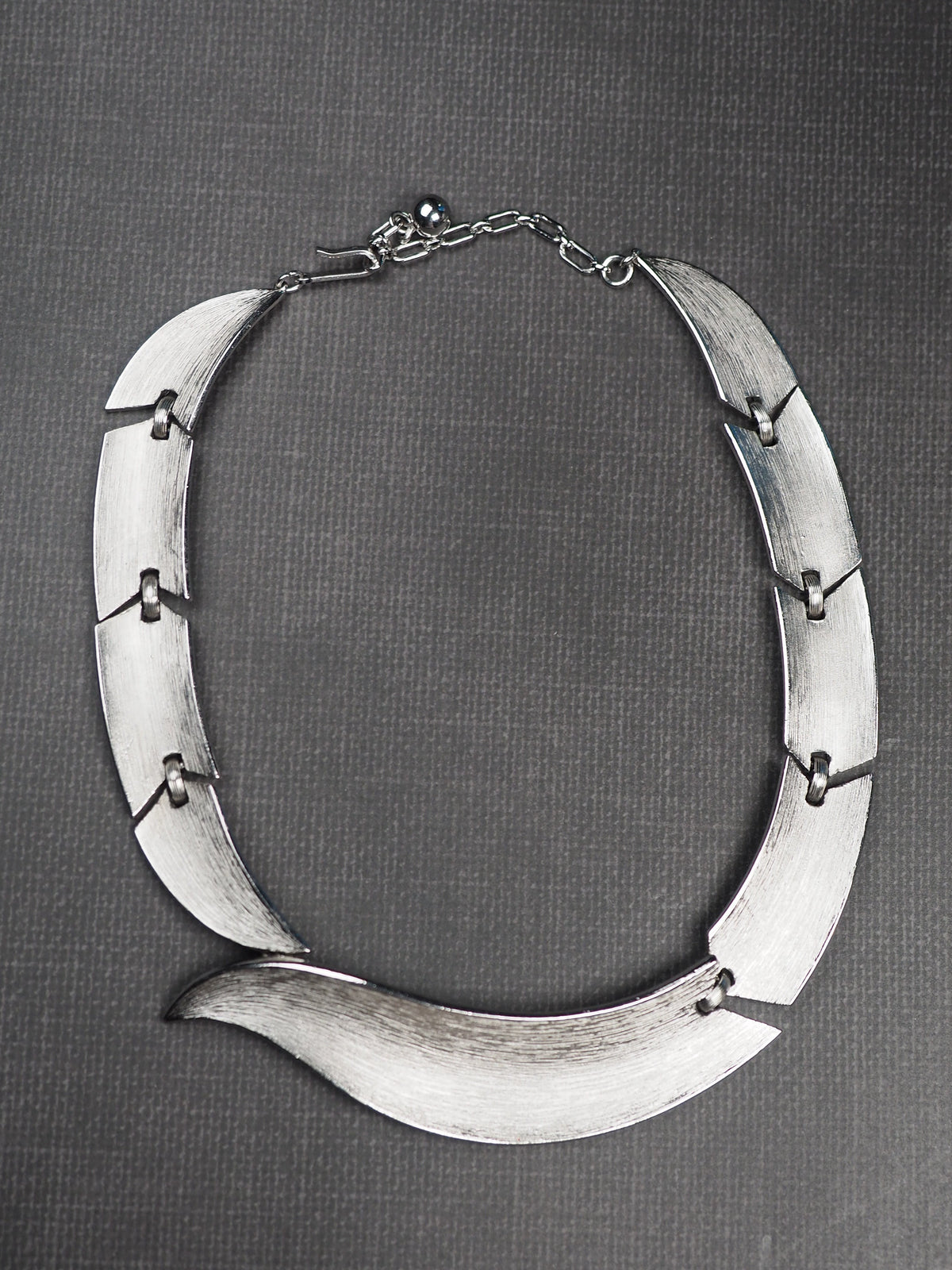 Trifari signature mark near clasp on silver-tone collar necklace