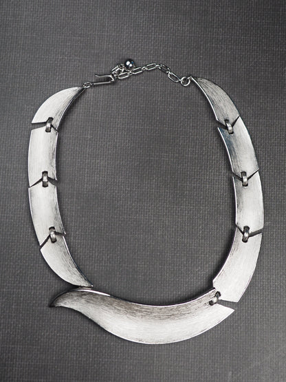 Trifari signature mark near clasp on silver-tone collar necklace